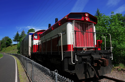 Image of cargo freight train engine on railroad tracks