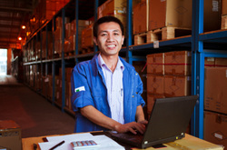 Image of warehouse employee at his computer